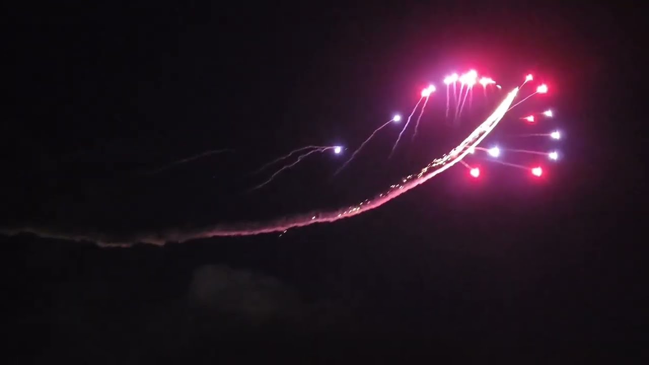 Fireworks launched by low flying airplane at night !