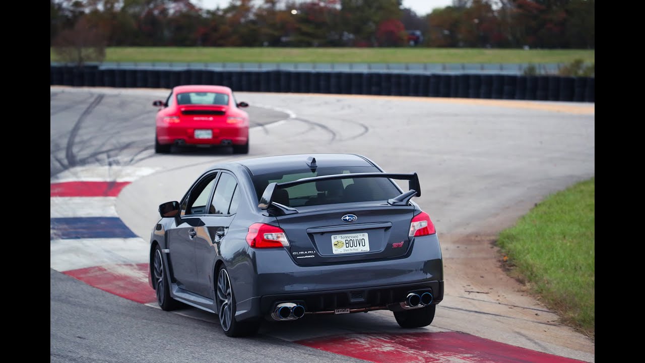 Subaru WRX STI racing Porsche Carrera 911 S