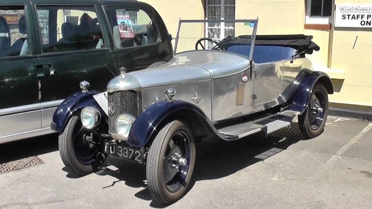 A VINTAGE CAR AND CLASSIC TRAIN