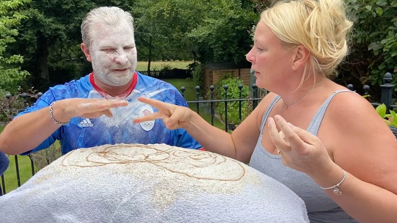 Husband And Wife Play Rock, Paper, Scissors With Flour