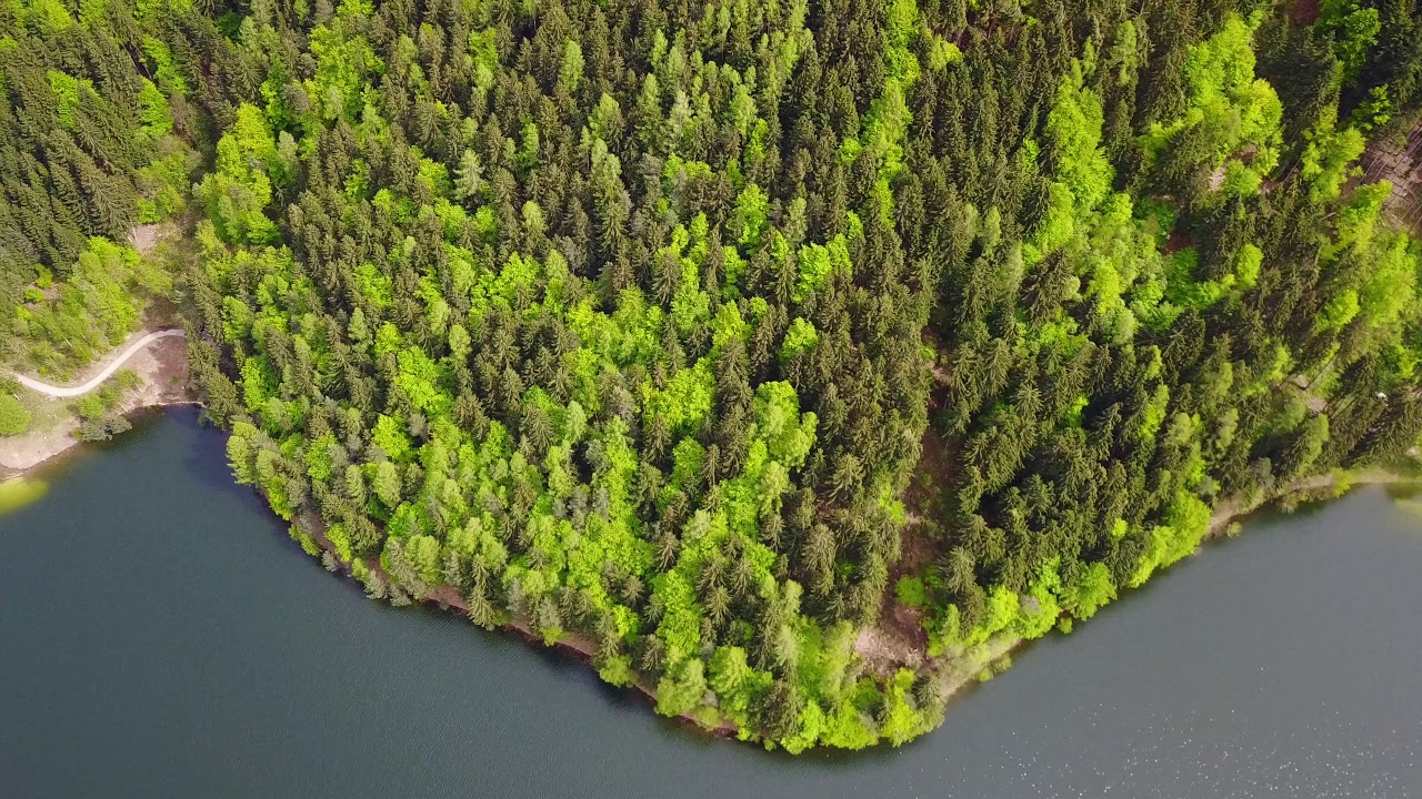 A day of MAY in the ALPS and SERRAIA LAKE - DRONE 4K UHD