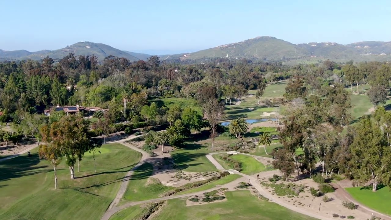Aerial view over golf during sunny day in San Diego | 4K Free Stock Video