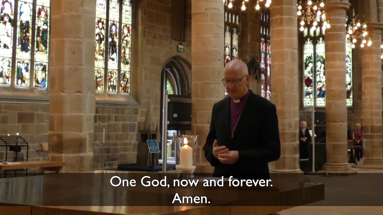 Bishop Nick Baines prays inside Wakefield Cathedral on the day of its re-opening