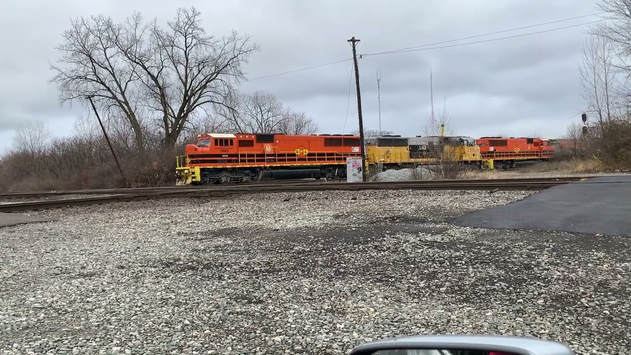 two different trains at L M Cabin 12-27-2025 with a wacky conductor