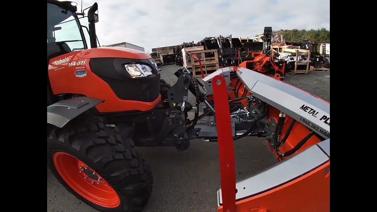 Kubota M4 tractor with a Metal Pless snow plow