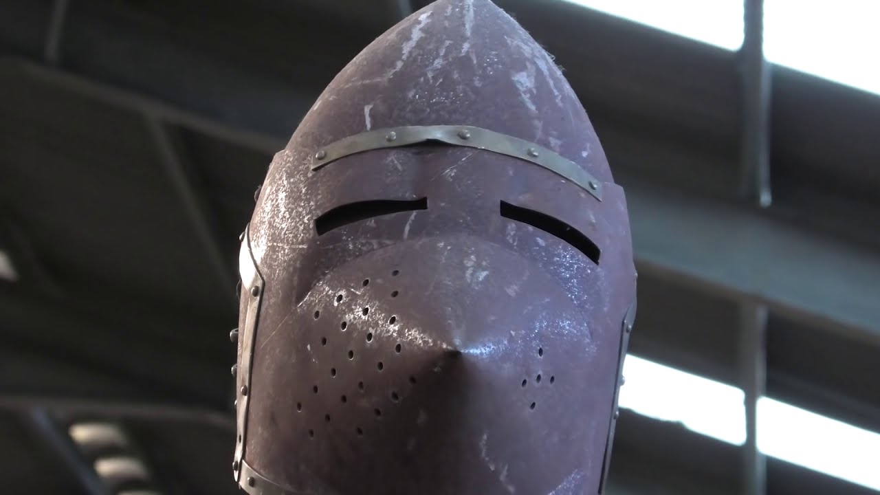 Medieval helmet: How is the shape of a helmet designed to protect? (testing it with a lance)