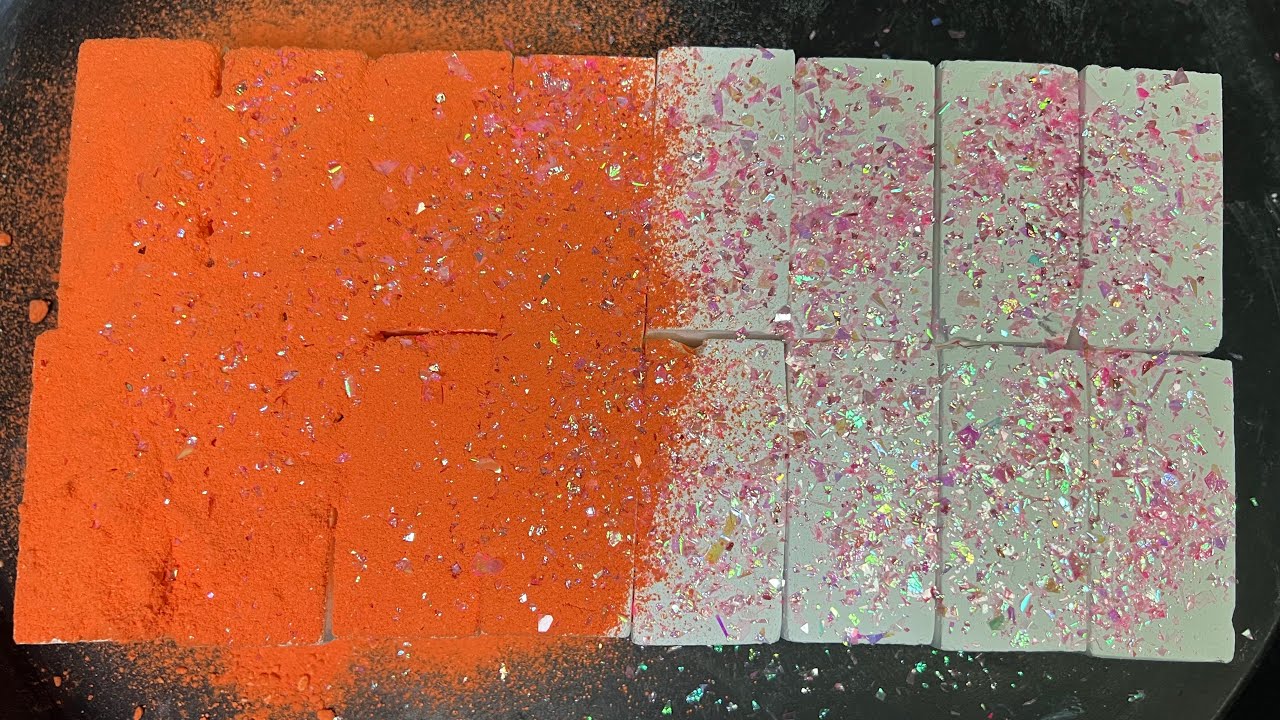 Fresh chalk blocks with orange pigment and pink glitter topped | ASMR
