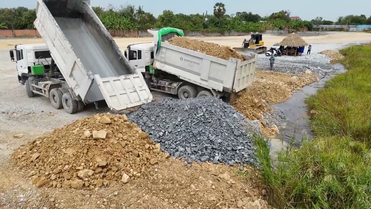 New Landfill Site Dozer DH17C3 Pushing The Soil into The Hole Building Stones Using Truck 12 wheel 
