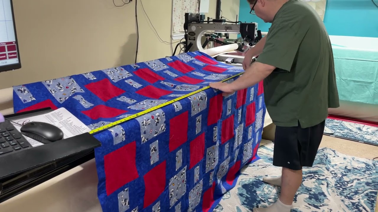 My husband Pete helping me with long arm quilting.