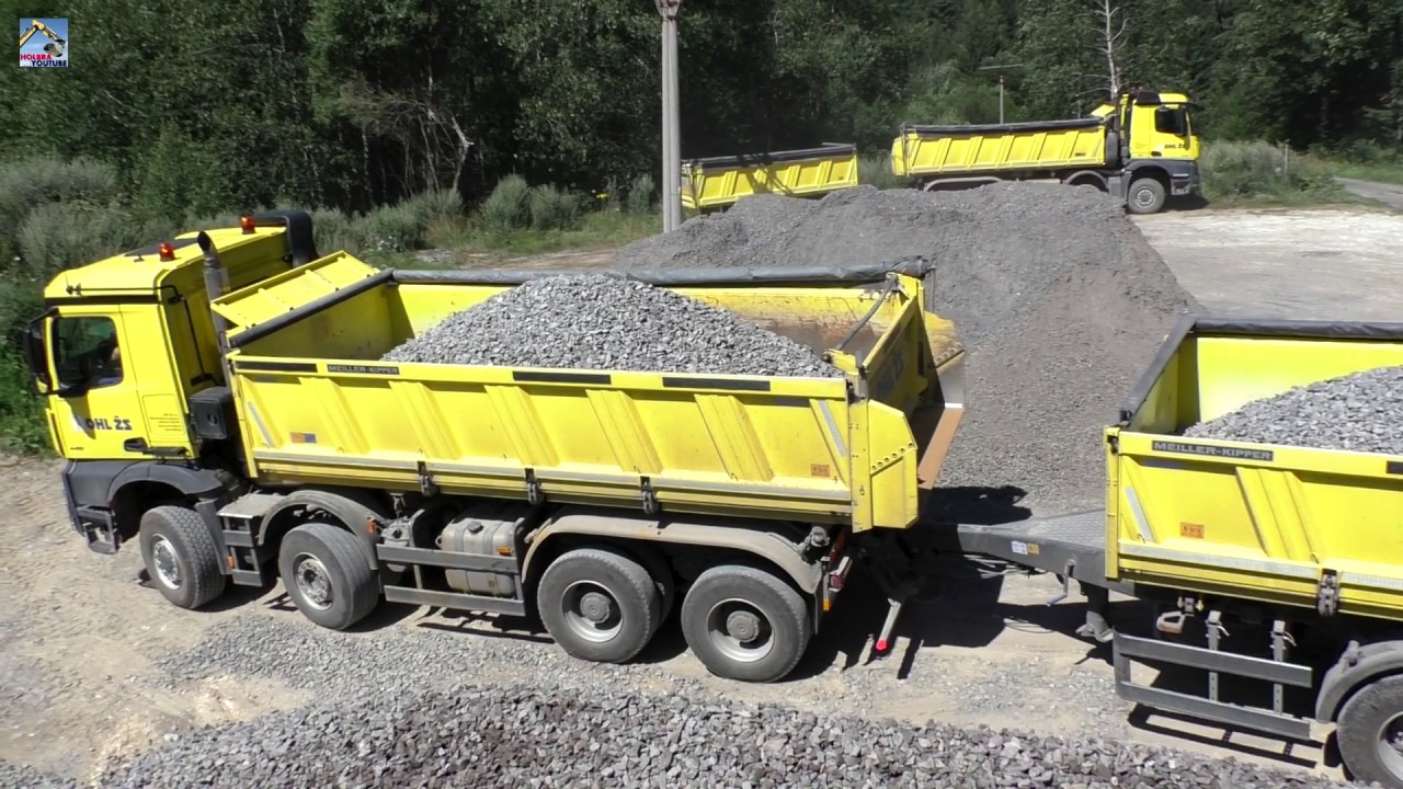 Mercedes Arocs and Tatra Phoenix with trailers unload stone
