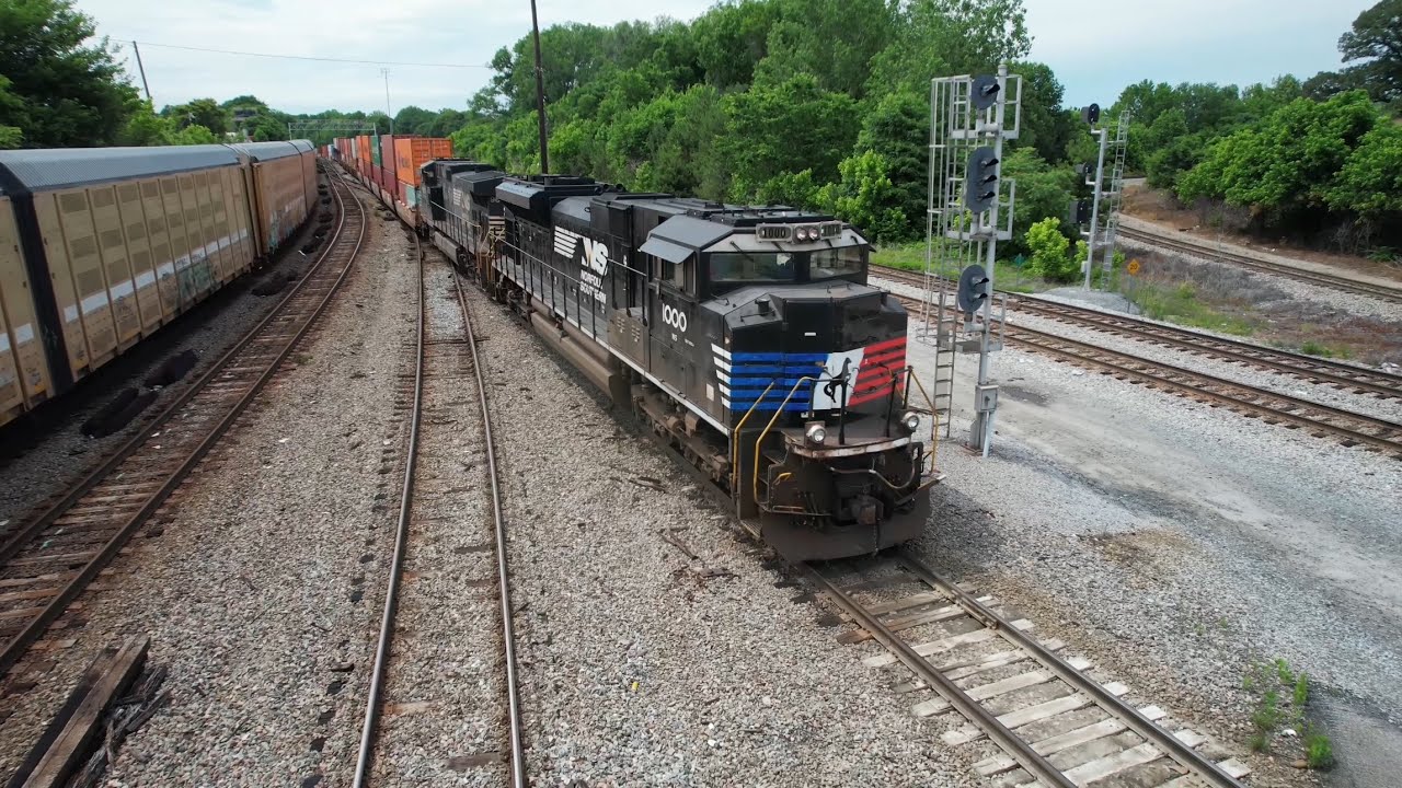 A Container Thief Jumps Off, an NS Coal Train, a CSX Freight and the Blue White and Red NS Unit