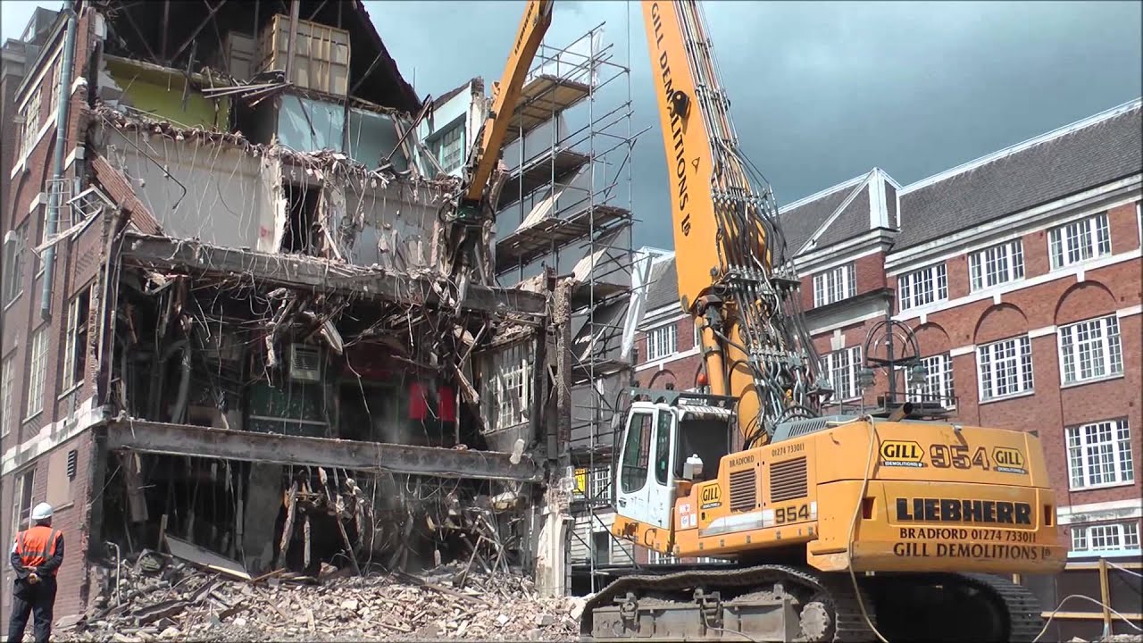Big long reach Liebherr demolition excavator working.