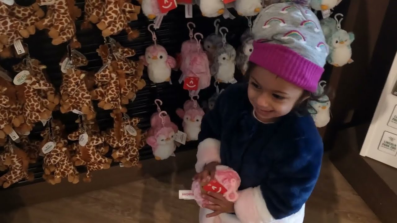 Lyra in the #Zoo Gift Shop.Her reaction captured for fun.She loves to see all her fav animals toys