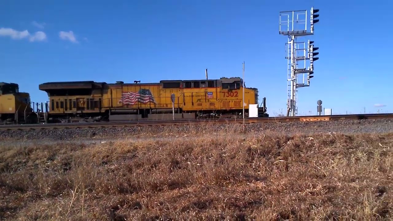 UP 7302 leading loaded coal train leaving Gibbon 