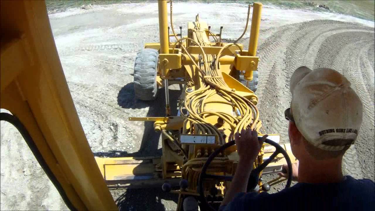 Motor Grader Grading Parking Lot