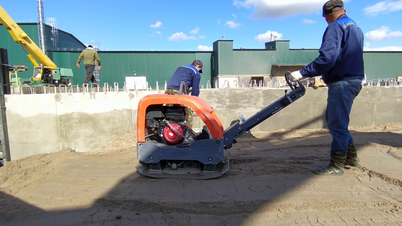 Compacting sand