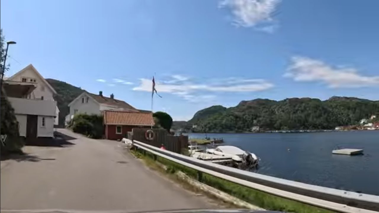 Rekefjord with beautiful wooden houses close to the sea.