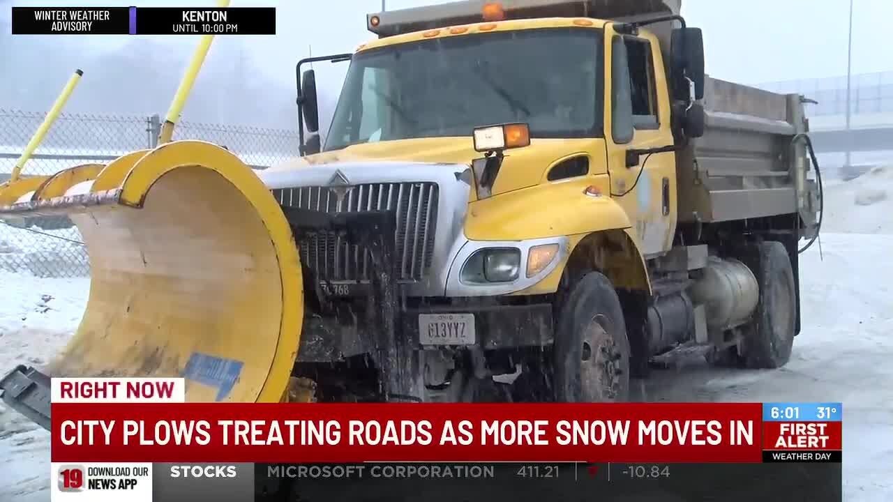 City plows treating roads for more snow after winter strom swept the region