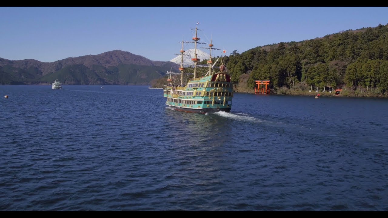 Aerial view tracking over Lake Ashinoko and Hakpne Shrine, with Mount Fuji in the distance, Fuji-Hak