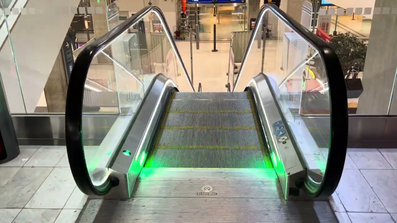 Paris CDG Airport. 5x Escalator ride & 5x Travelator between terminals 2F and 2C, via T2 station.