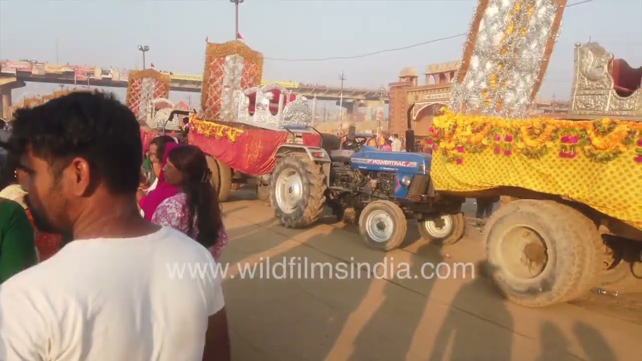 Maha Kumbh in Prayagraj showcasing a crowd of devotees and Sadhus moving through the sacred grounds