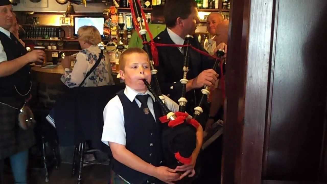 WEE PIPER PLAYS BALMORAL HIGHLANDERS IN PUB
