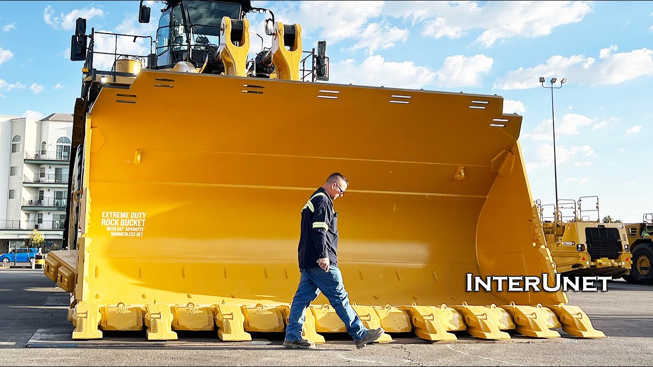 Massive Caterpillar Mining Largest Wheel Loader  Moving Out of MINExpo