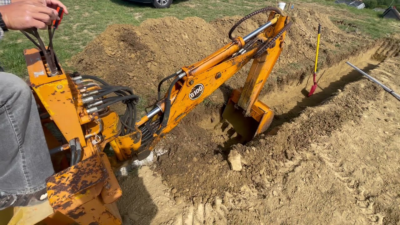 Digging Garage Footings w/ Davis D100 Back Hoe on a John Deere 317 Skid Steer. Custom House Build.