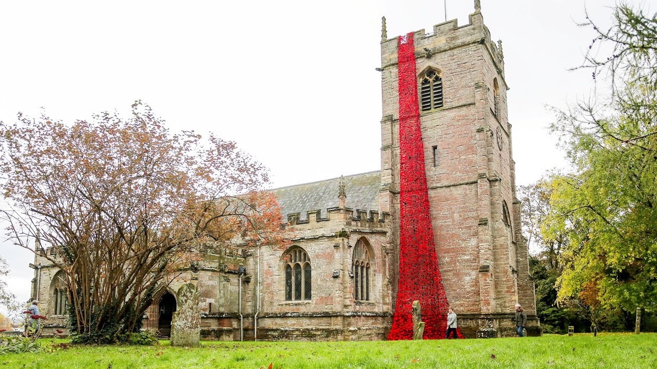 Thousands of knitted poppies cascade from church ahead of Remembrance Day | SWNS