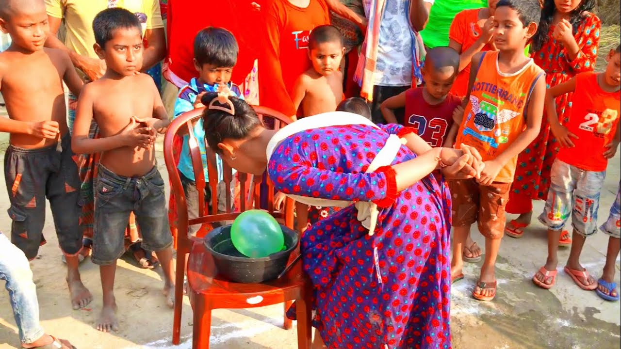 গ্রামের মেয়েদের মজার আজব খেলা পেন্সিল ও পা দ্বারা বেলন ফাটানো প্রতিযোগিতা যা দেখাতে এলাকায় ভিড়😳