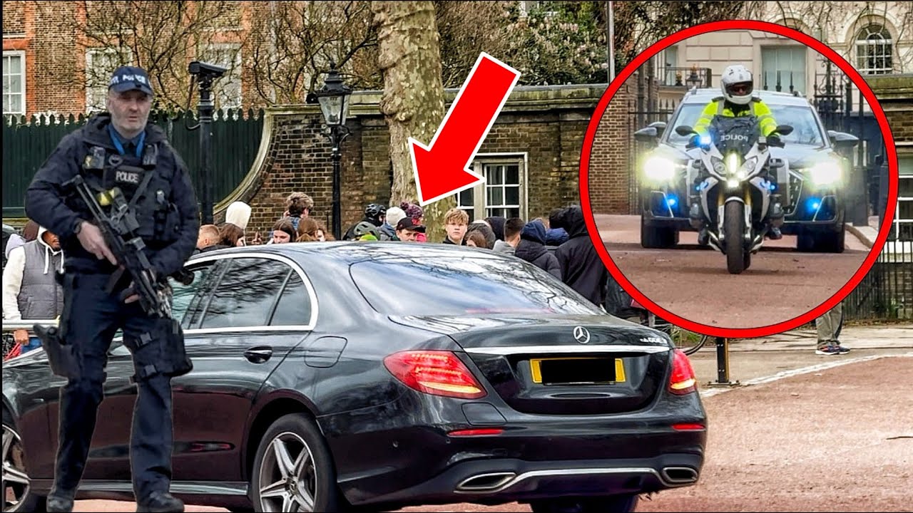 ROYAL SECURITY GRIPS WEAPON AS TINTED WINDOW CAR LURKS NEAR EXIT