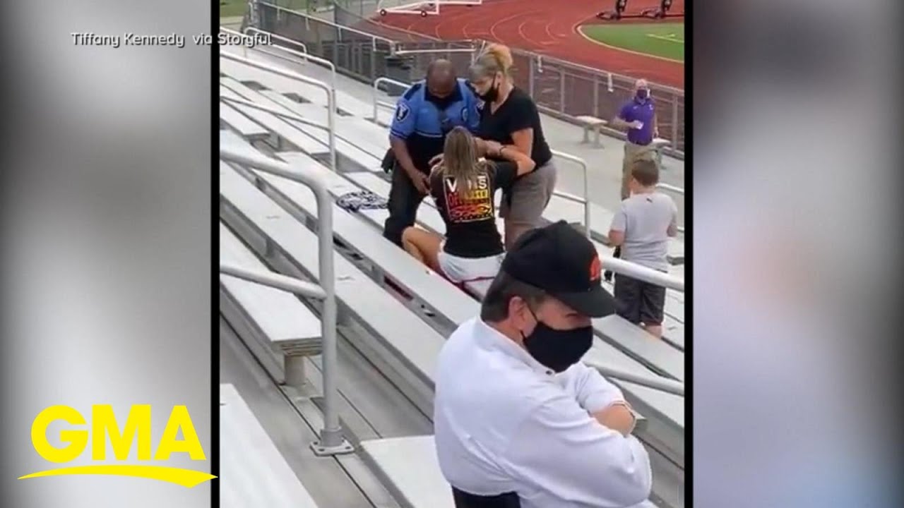 Officer tases, arrests woman for not wearing a mask at football game l GMA