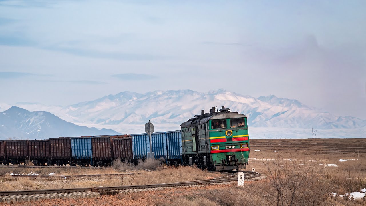 Diesel locomotive 2TE10V-5051 with a freight train filled with coal on the Tokmak - Ivanovka section