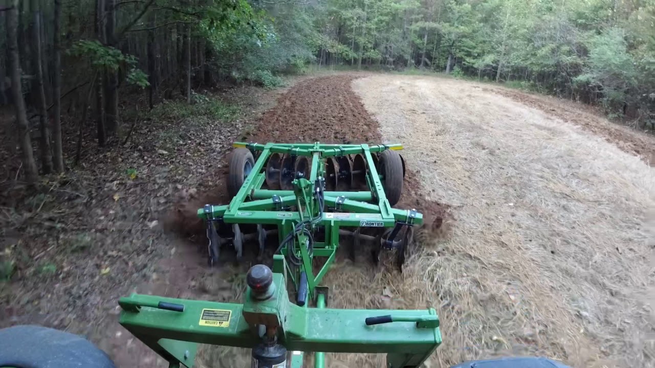 John Deere discing the last small food plots