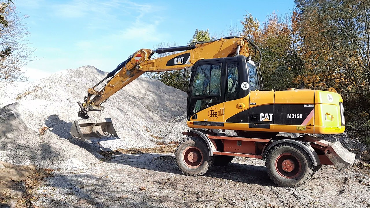 Koparka kołowa CAT M315D, 4x4 + hydrauliczna łyżka skarpowa na aukcji Flotilo.pl 1/2