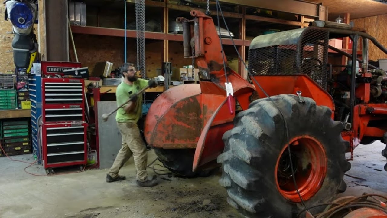 Pulling the fairlead and winch from the Timberjack 360 Skidder