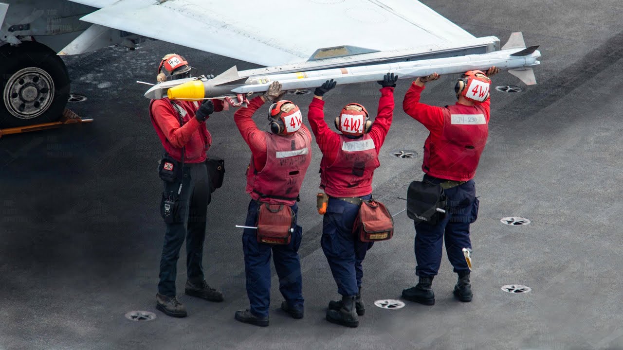 Loading US F-18 With Tons of Ordnance Aboard Aircraft Carrier