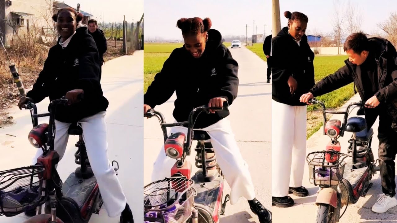 Jin Tao teaches Anjina how to ride an electric bicycle