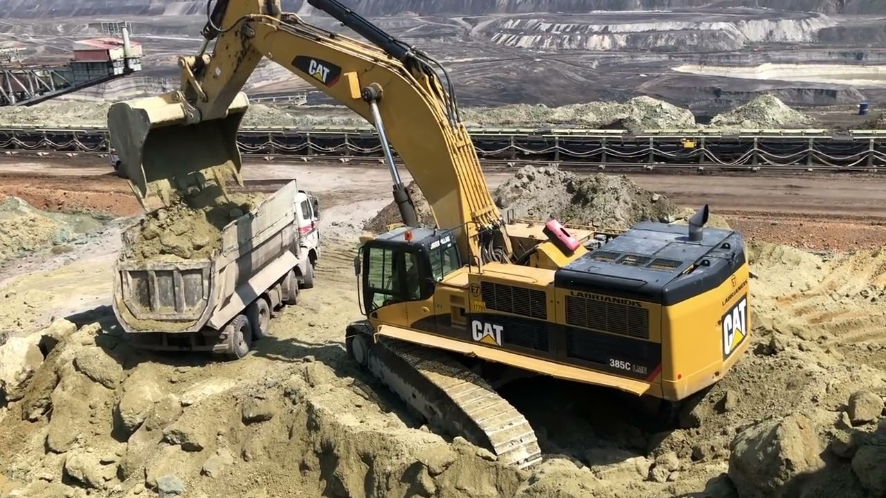 Caterpillar 385C Excavator Loading Mercedes And MAN Trucks - Labrianidis Mining Works