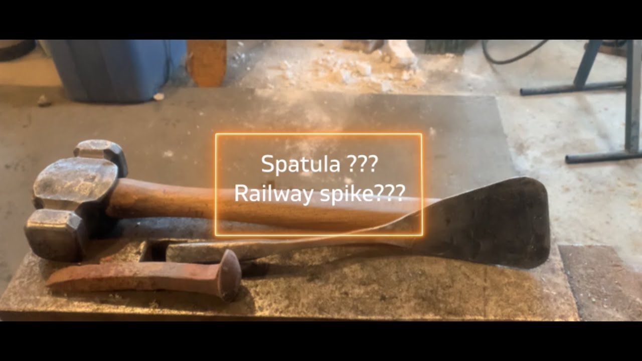 Railway spike spatula