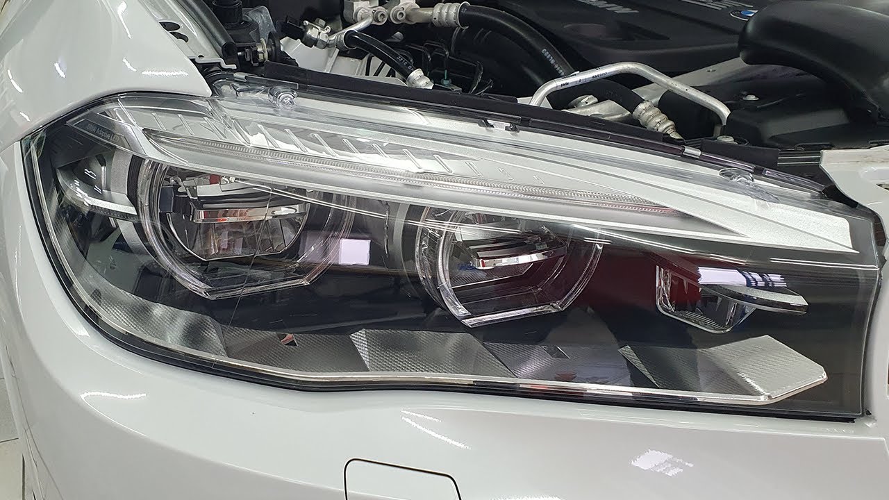 How to install paint protection film (clear bra) on a car headlights. Auto detailing.