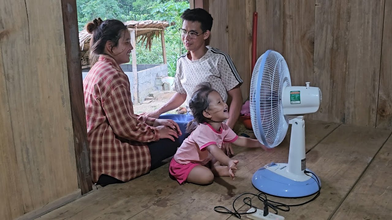 The mother and son were very happy when the engineer bought fans for them.