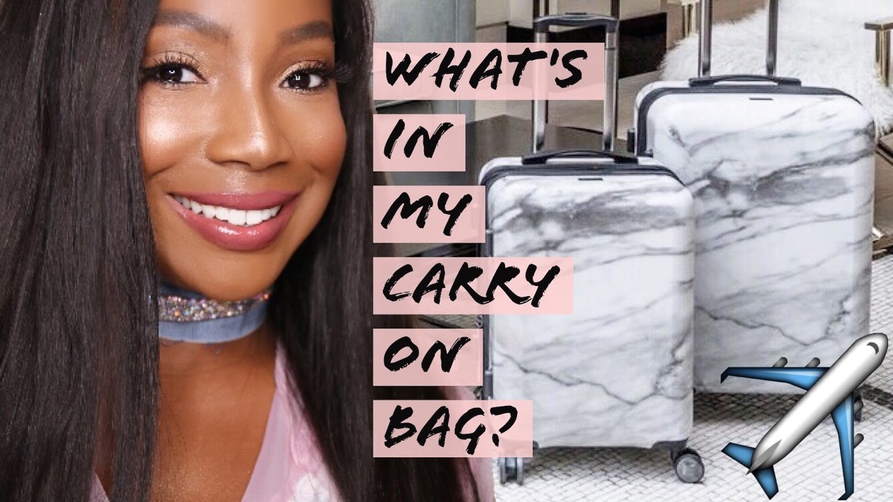 TRAVEL ESSENTIALS: WHATS IN MY CARRY ON BAG? | Whitney Wiley