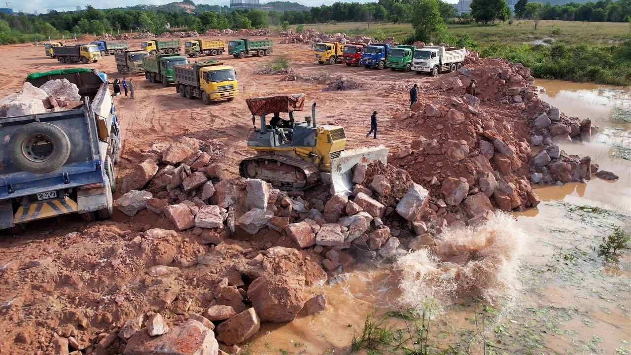 Excellent Landfilling Activities Heavy Equipment Working Bulldozer Pushes Rock & Soil Ft Dump Truck