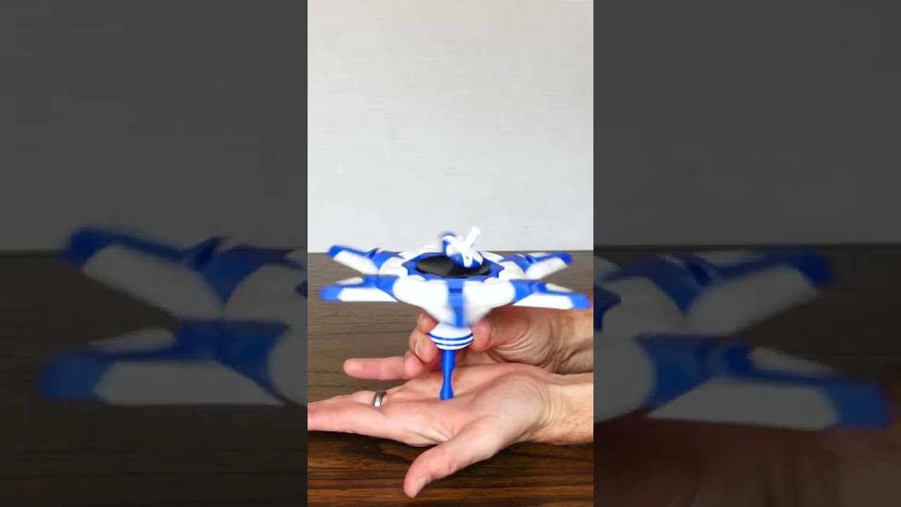 Spinning a Top Within a Top