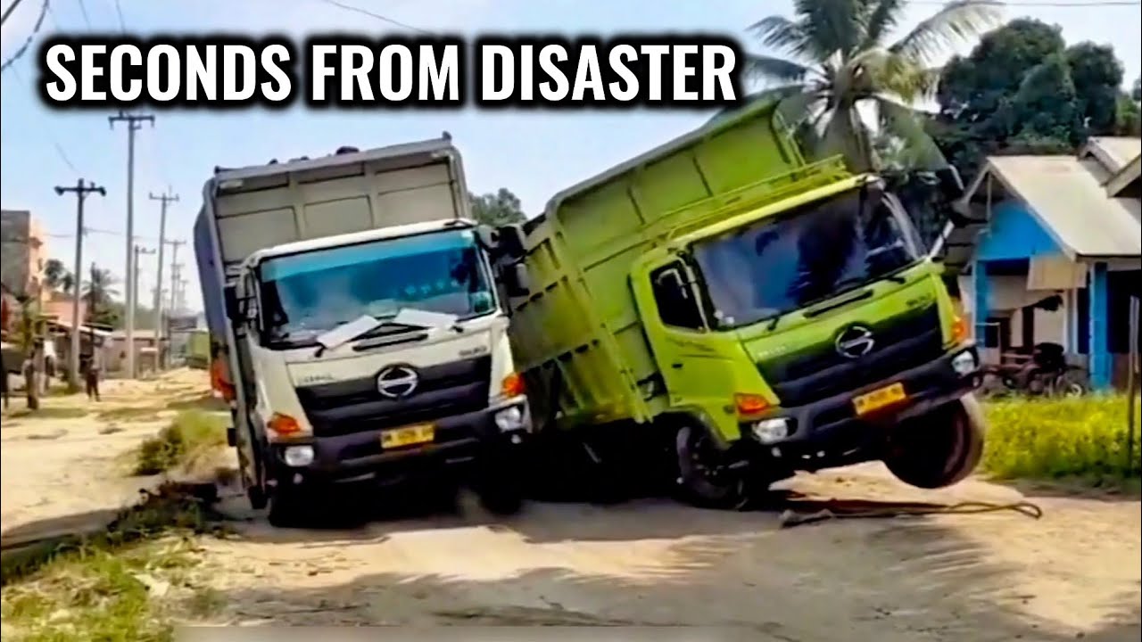 Two Heavy Trucks Tilted Sideways — Seconds from a Deadly Accident