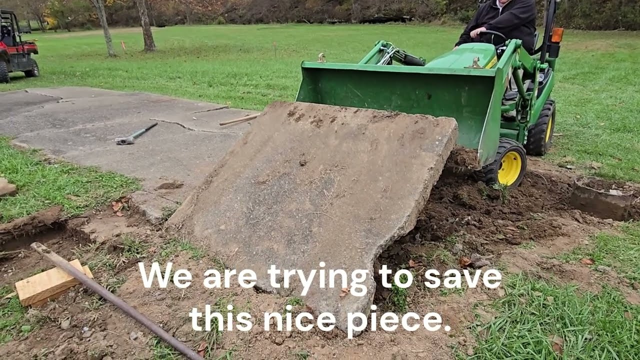Tearing Out Concrete Pad with the JD 1025R
