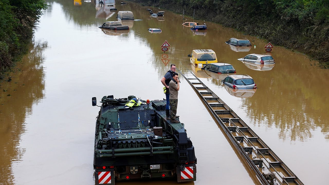 Germany floods: Military clears submerged road in search & rescue operation