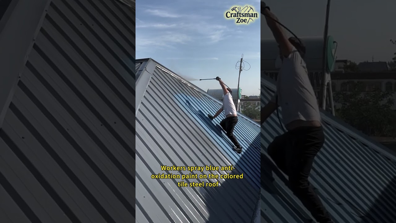 Workers spray blue anti-oxidation paint on the colored tile steel roof