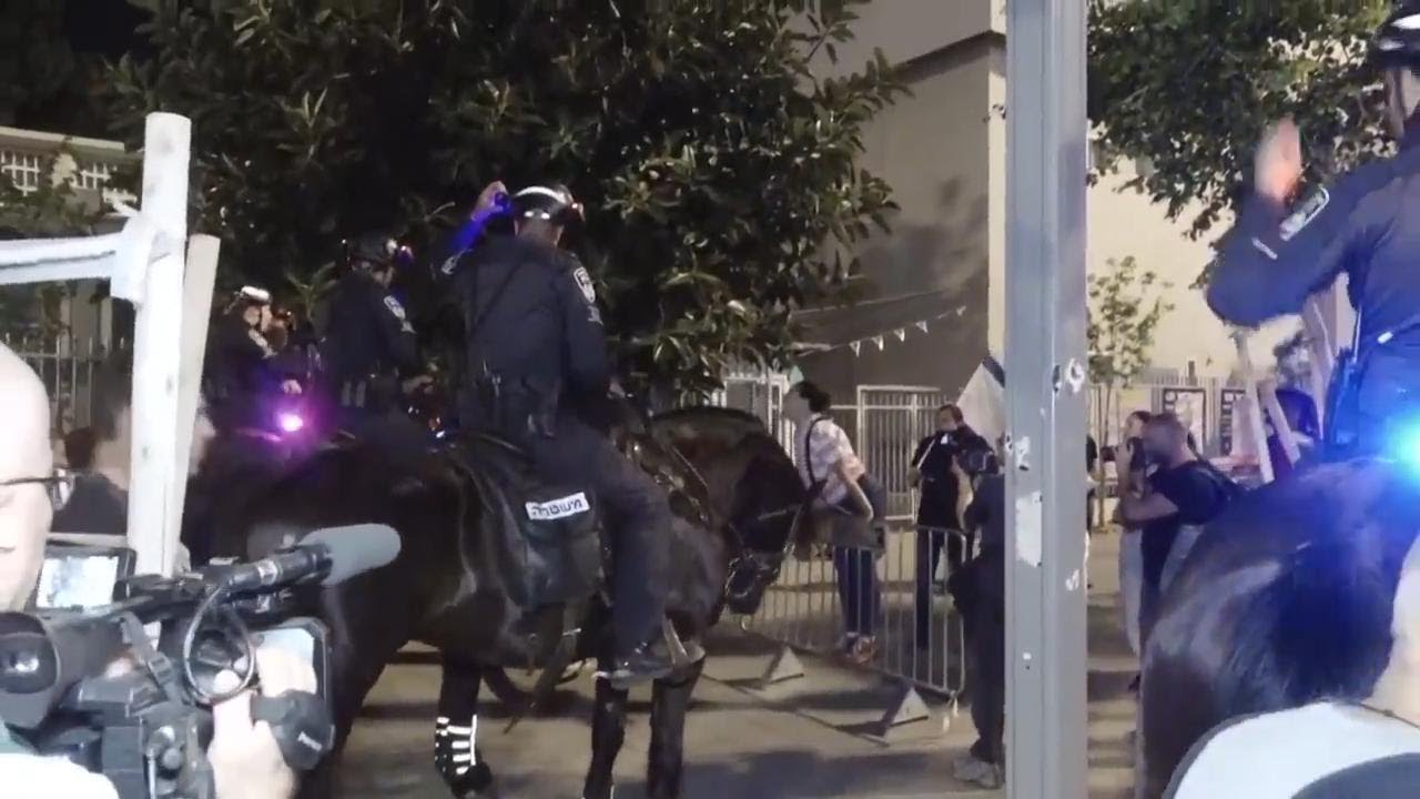 Mounted police confront anti-government protesters in Tel Aviv